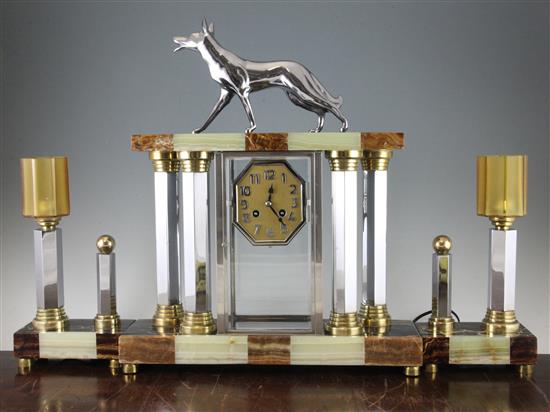 Attributed to Michel Decoux. A French Art Deco marble, onyx and chrome clock garniture, clock 20in.